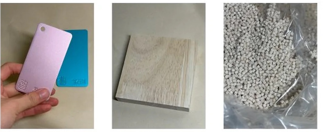 Physical color and material samples including anodized metal chips, light wood, and polymer pellets
