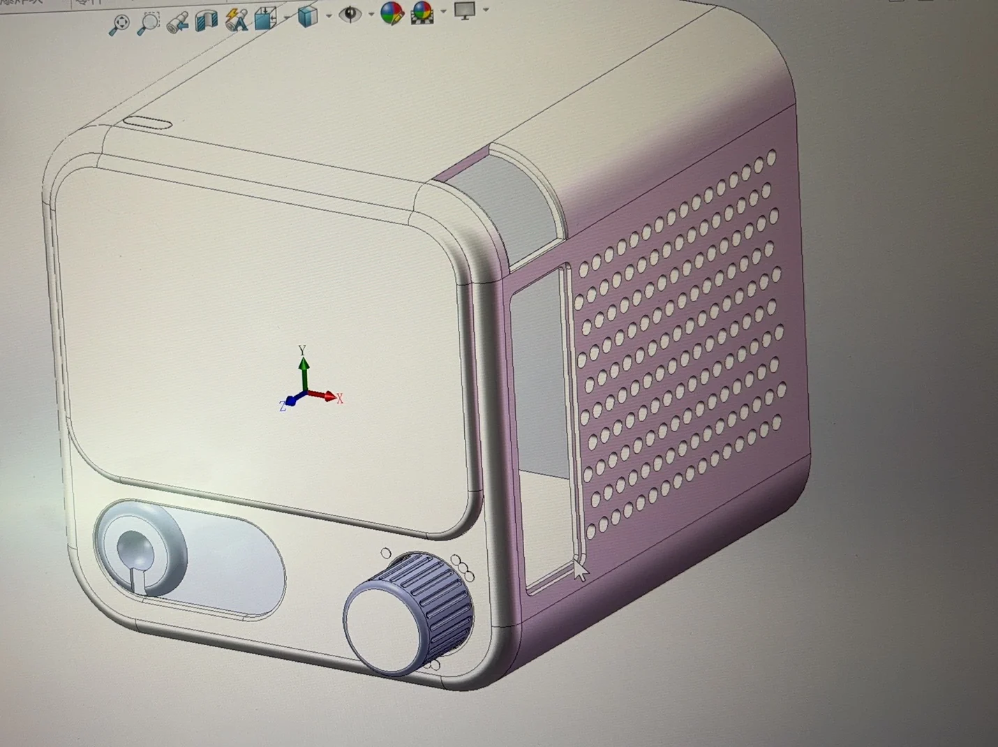 SolidWorks study of a larger radio-like narrative module with a card slot, speaker field, screen, and controls
