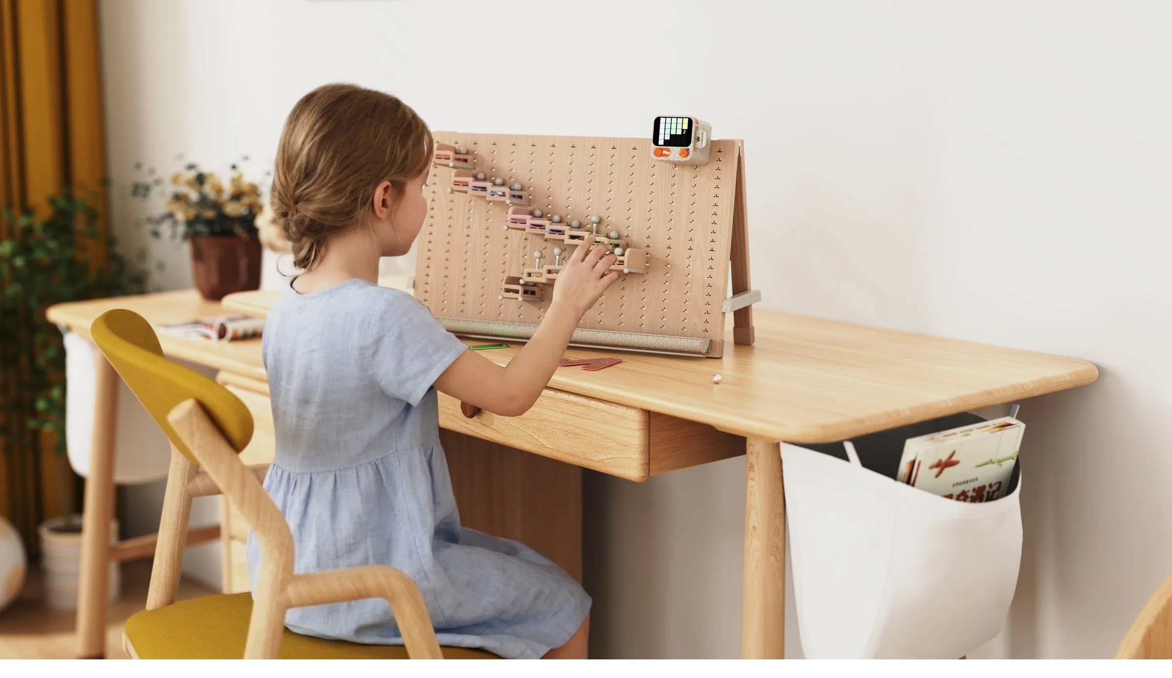 A child configuring the Melody Adventurer musical construction game